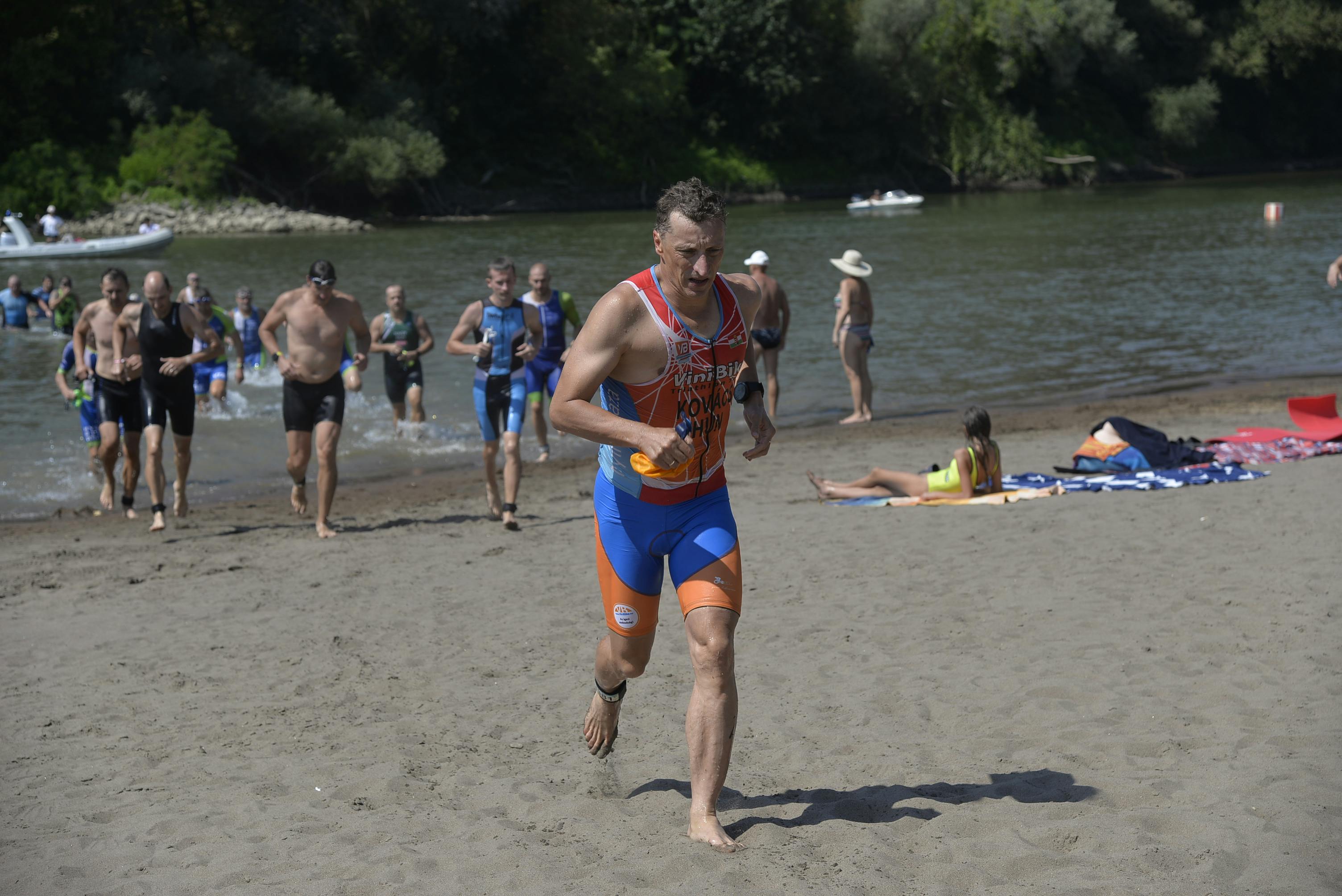 Triathletes transition from swim to run during a multisport race