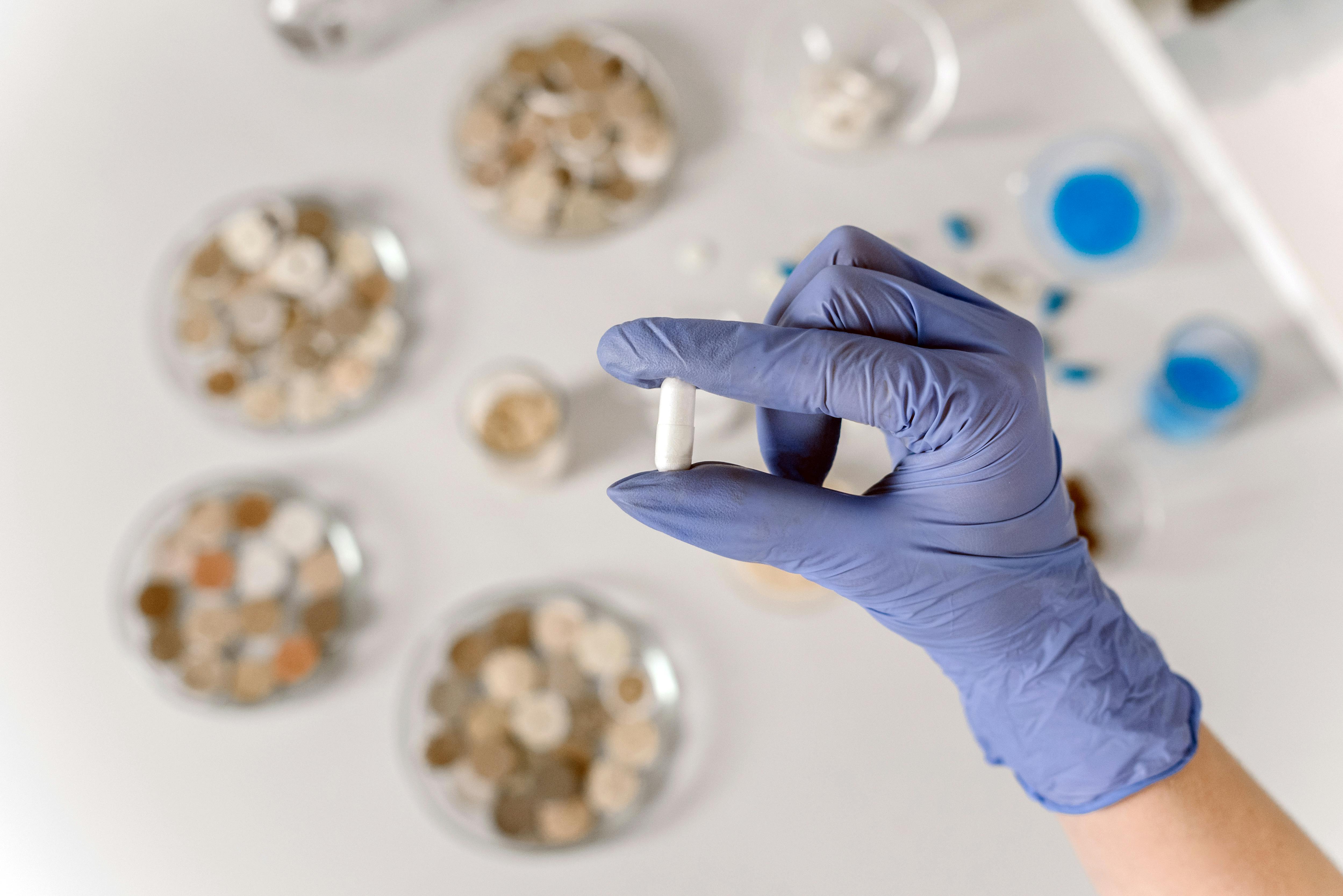 Magnesium supplement capsules and powder on a neutral surface