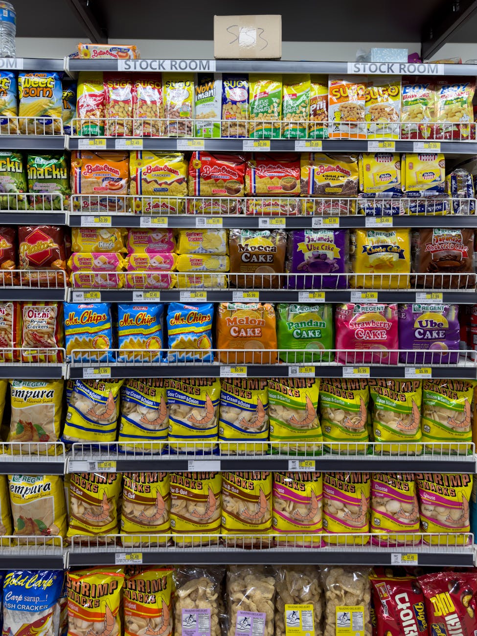 Ultra-processed packaged foods arranged on a table, illustrating research into food processing and brain health.
