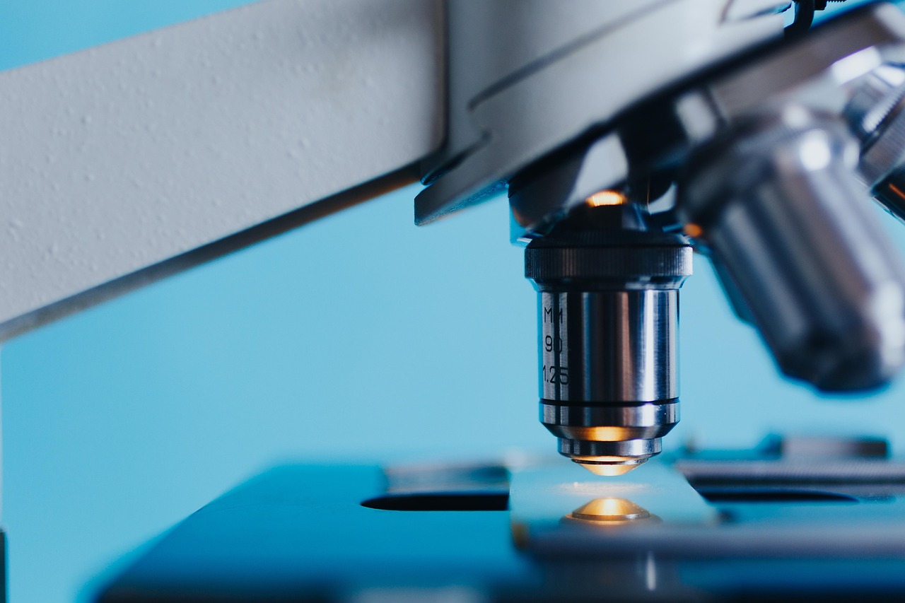 Microscope and lab equipment illustrating gut-microbiome research