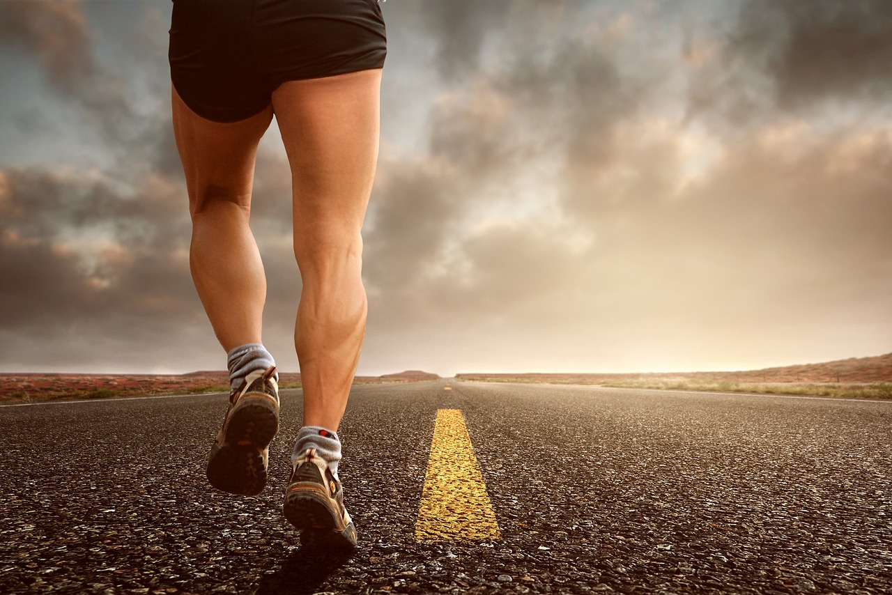 Runner's legs on a road during training