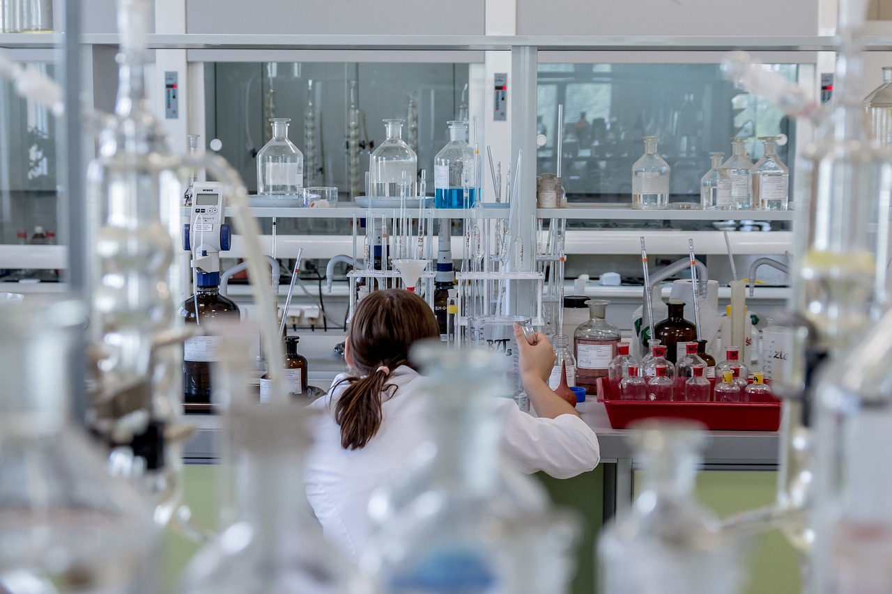 Laboratory scientist with test tubes illustrating women's health research