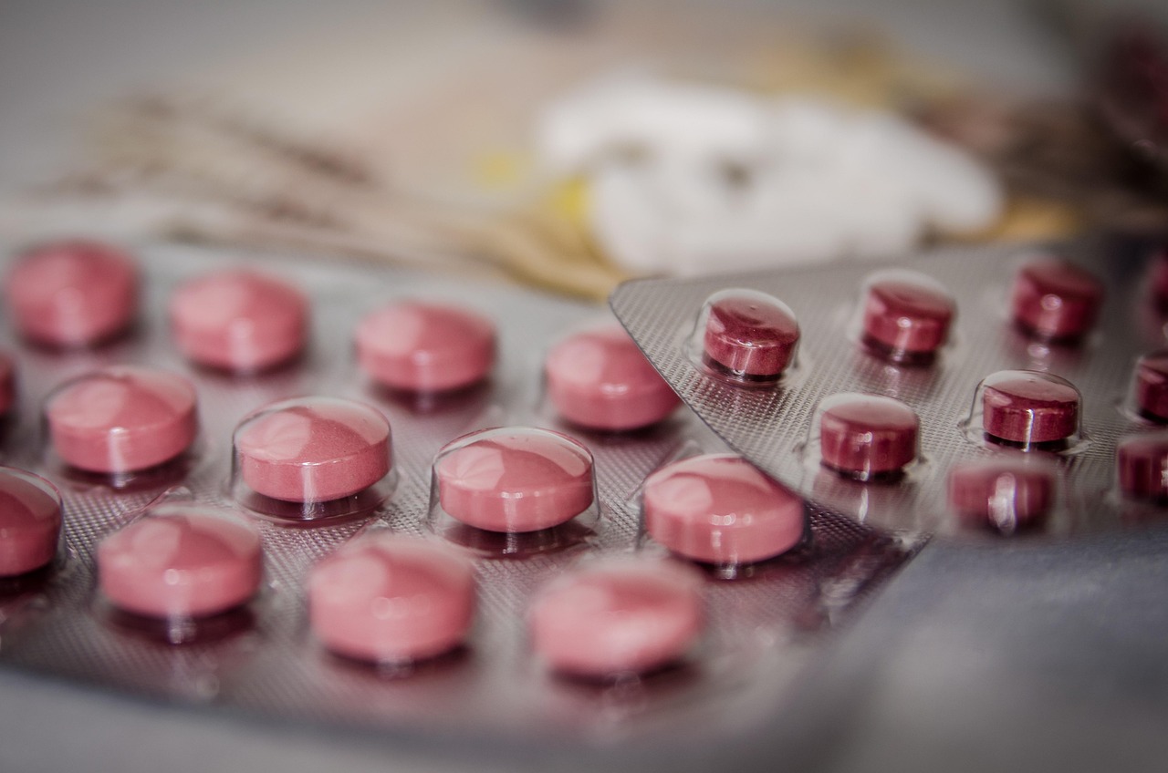 Cold and flu tablets and capsules arranged for an over-the-counter medicine explainer